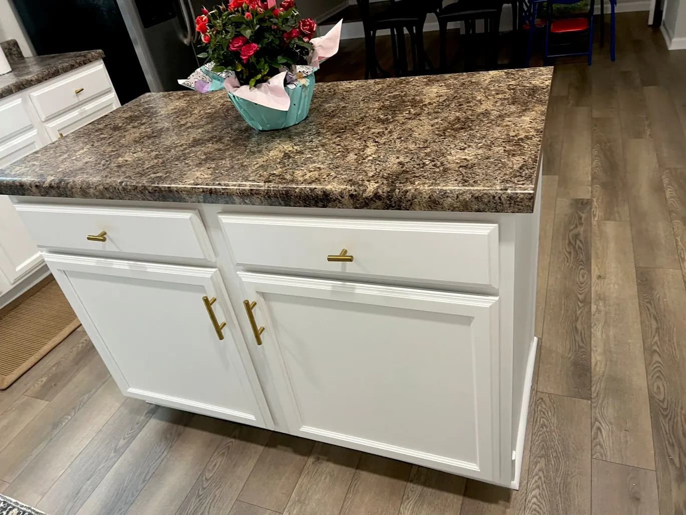 White painted kitchen island with brass handles